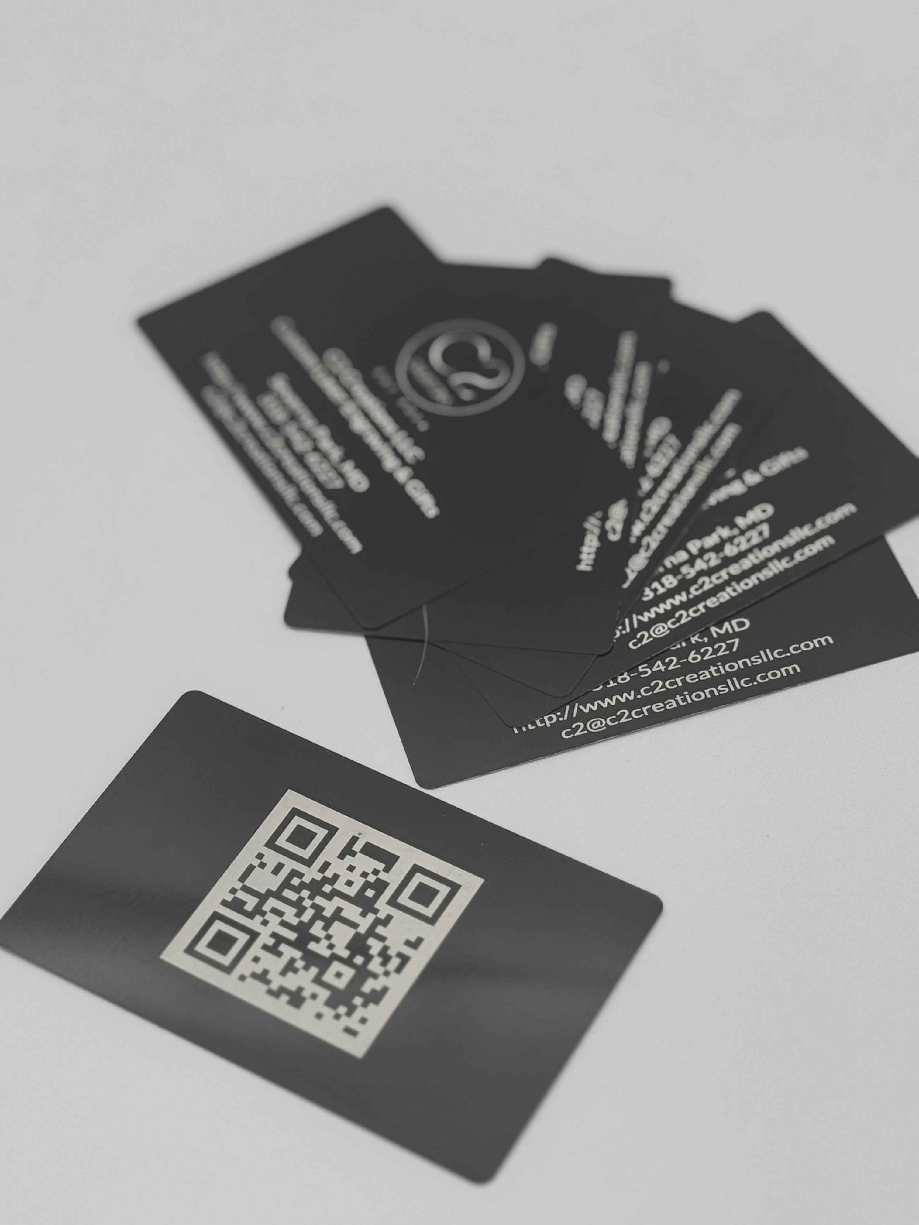 Engraved metal business card detail with custom design
