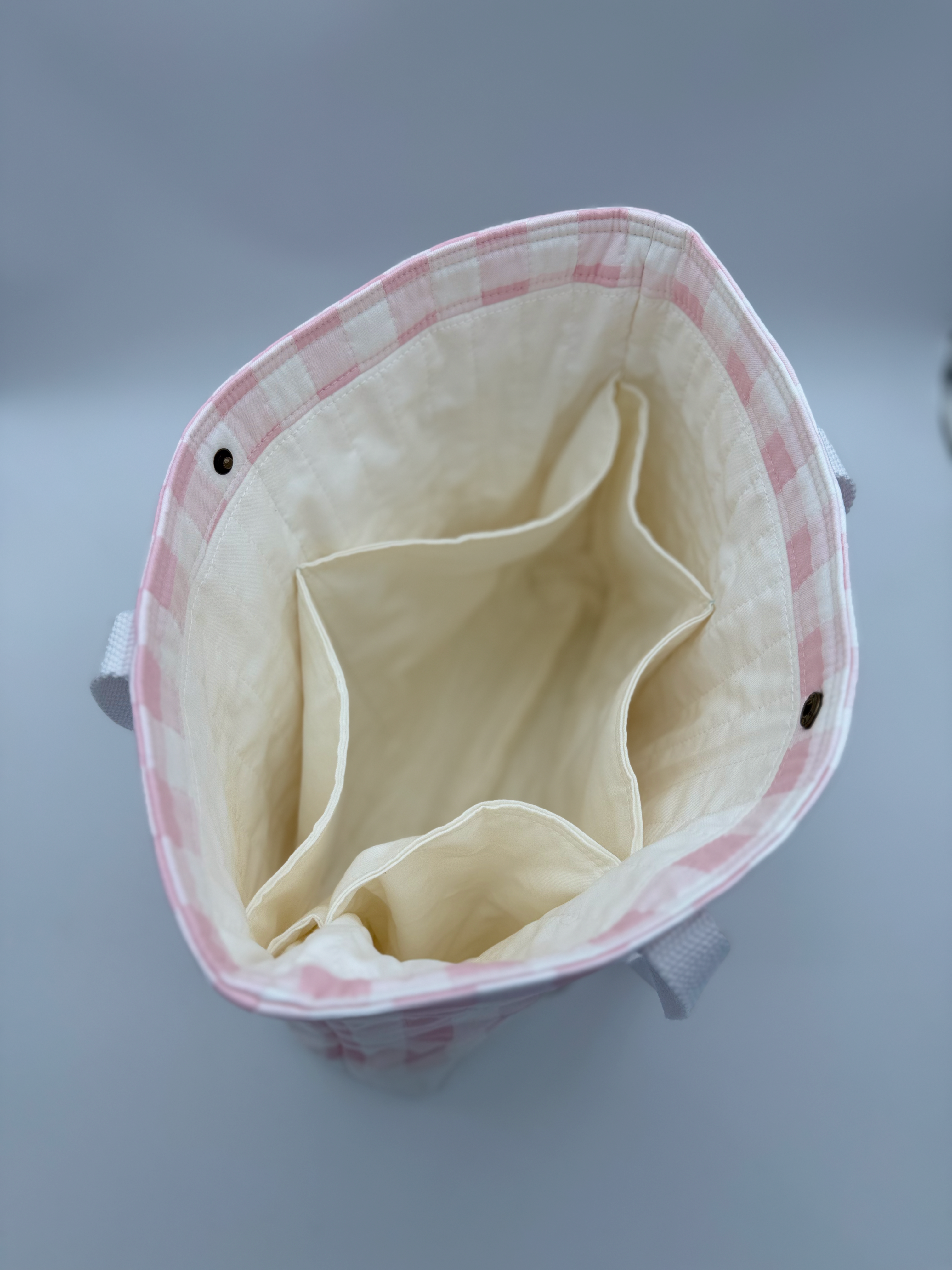 Interior of pink gingham handmade tote bag with snap closure